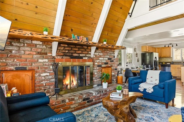 1296 Calgary Dr, Lake Arrowhead, CA 92352 - living room with a brick fireplace, wood finished floors, and wooden ceiling