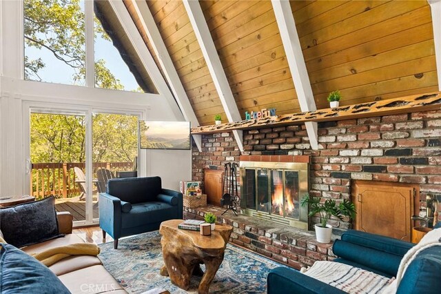 1296 Calgary Dr, Lake Arrowhead, CA 92352 - living room with a fireplace, beam ceiling, wood finished floors, and high vaulted ceiling