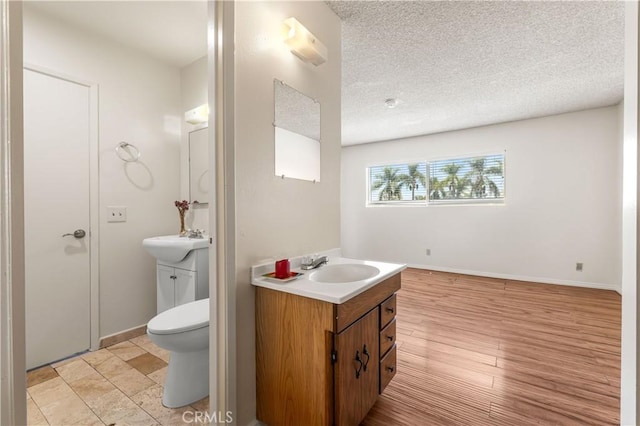 5530 Ackerfield Ave Unit 206, Long Beach, CA 90805 - bathroom with vanity and a textured ceiling