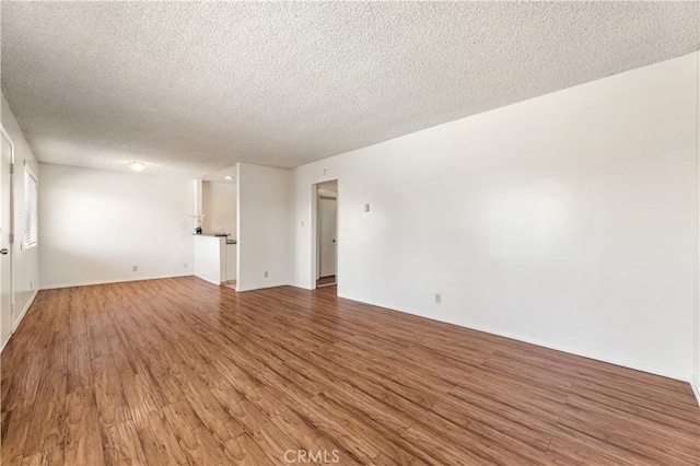 5530 Ackerfield Ave Unit 206, Long Beach, CA 90805 - spare room with wood finished floors and a textured ceiling
