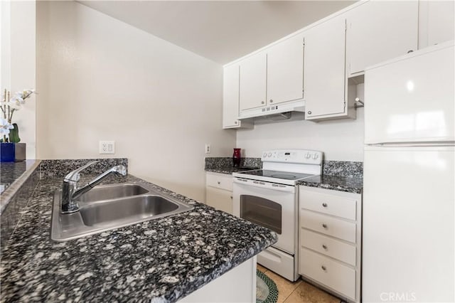 5530 Ackerfield Ave Unit 206, Long Beach, CA 90805 - kitchen featuring white appliances, white cabinets, under cabinet range hood, light tile patterned floors, and dark stone countertops