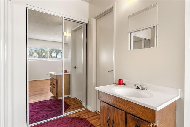 5530 Ackerfield Ave Unit 206, Long Beach, CA 90805 - bathroom featuring vanity and wood finished floors