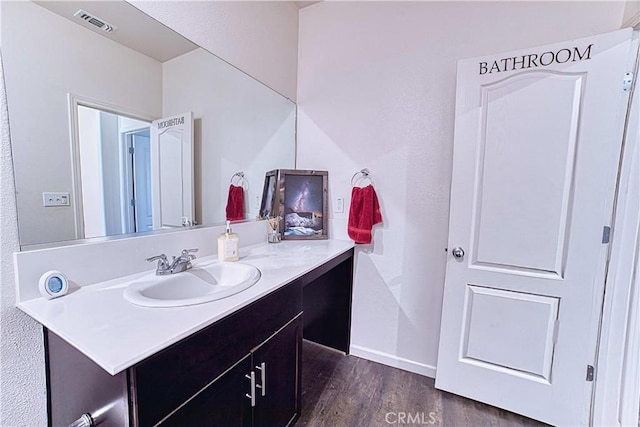 4262 Theresa Ln, Merced, CA 95348 - bathroom with vanity and wood finished floors