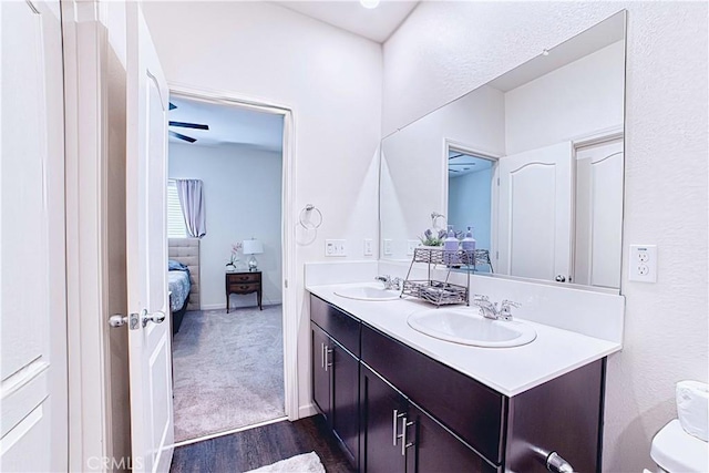 4262 Theresa Ln, Merced, CA 95348 - full bathroom with connected bathroom, double vanity, and wood finished floors