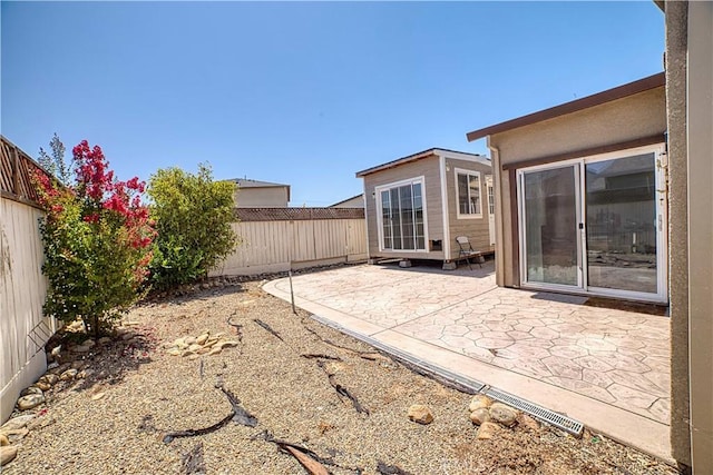 4262 Theresa Ln, Merced, CA 95348 - fenced backyard featuring a patio area
