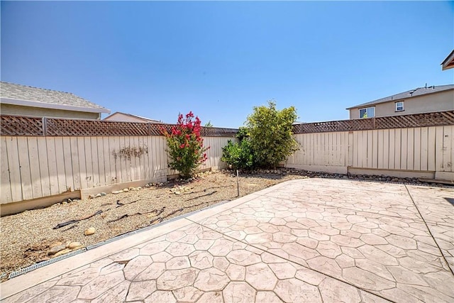 4262 Theresa Ln, Merced, CA 95348 - fenced backyard featuring a patio area
