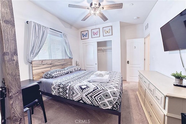 4262 Theresa Ln, Merced, CA 95348 - bedroom featuring light colored carpet, a closet, and a ceiling fan