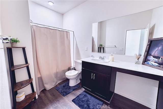 4262 Theresa Ln, Merced, CA 95348 - bathroom featuring wood finished floors, vanity, and shower / bath combination with curtain