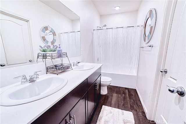 4262 Theresa Ln, Merced, CA 95348 - bathroom featuring double vanity, wood finished floors, and shower / bath combination with curtain