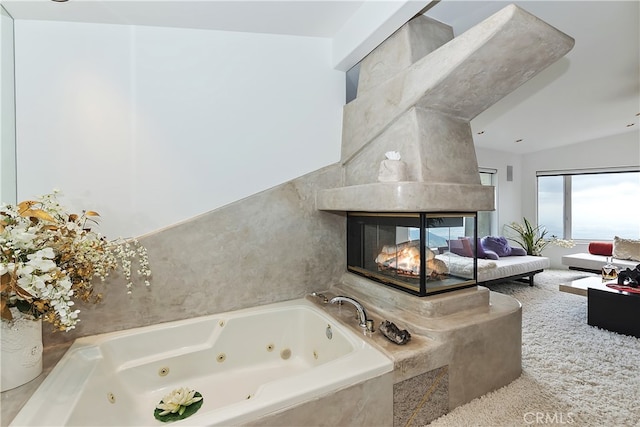 28527 Willow Rd, Lake Arrowhead, CA 92385 - bathroom featuring a tub with jets and a tiled fireplace