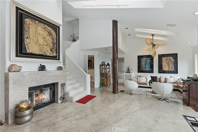 28527 Willow Rd, Lake Arrowhead, CA 92385 - living room with a fireplace, stairs, and high vaulted ceiling