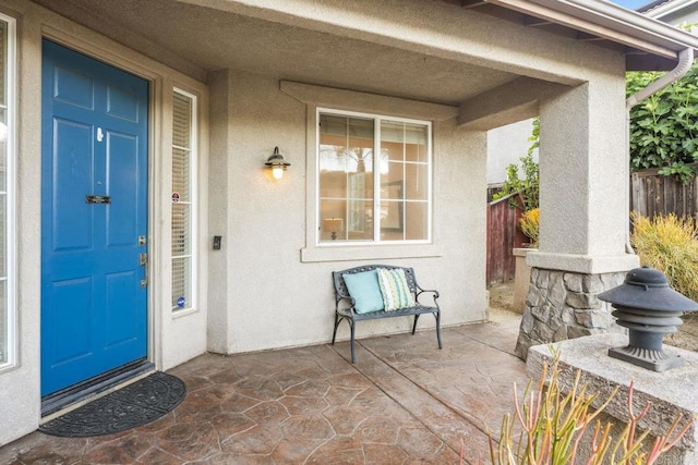737 W Bel Esprit Cir, San Marcos, CA 92069 - view of exterior entry featuring stucco siding and a patio