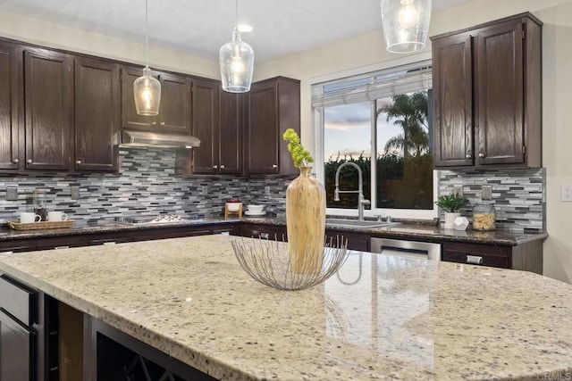 737 W Bel Esprit Cir, San Marcos, CA 92069 - kitchen featuring dark brown cabinets, light stone countertops, and pendant lighting