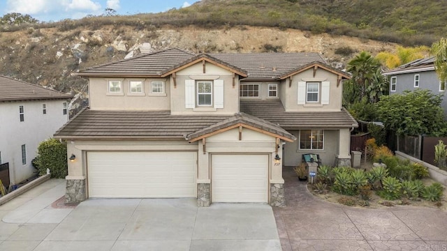 737 W Bel Esprit Cir, San Marcos, CA 92069 - traditional home with an attached garage, concrete driveway, stucco siding, and a tile roof