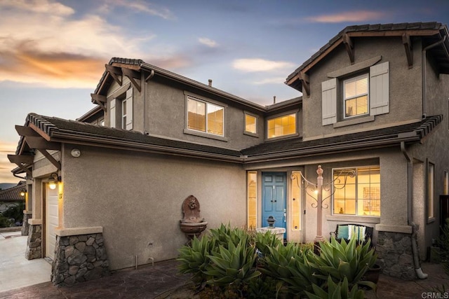 737 W Bel Esprit Cir, San Marcos, CA 92069 - back of house at dusk with stucco siding and an attached garage