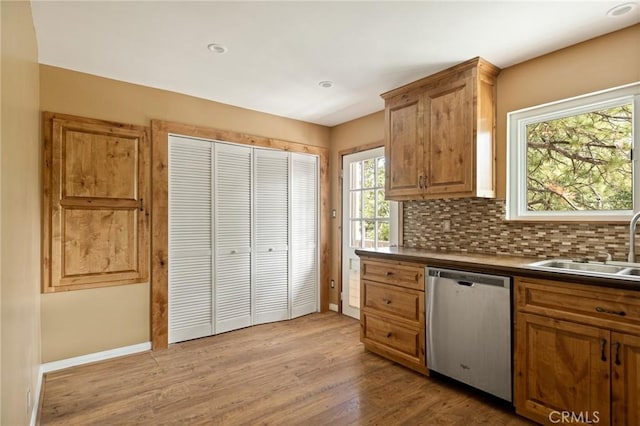 33159 Ridge Rd, Arrowbear, CA 92308 - kitchen with dishwasher, plenty of natural light, wood finished floors, and decorative backsplash