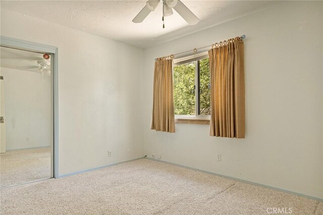 33159 Ridge Rd, Arrowbear, CA 92308 - empty room with a ceiling fan and carpet floors