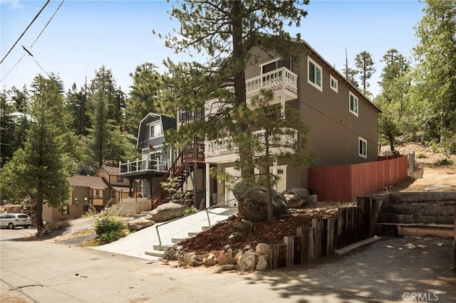 33159 Ridge Rd, Arrowbear, CA 92308 - view of front facade with a balcony and stairs