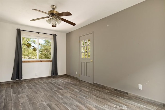 33159 Ridge Rd, Arrowbear, CA 92308 - spare room featuring healthy amount of natural light, ceiling fan, and wood finished floors