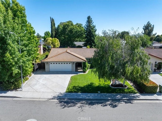 836 Bolen Dr, Paso Robles, CA 93446 - view of front of house with a tile roof, stucco siding, a garage, concrete driveway, and a front yard