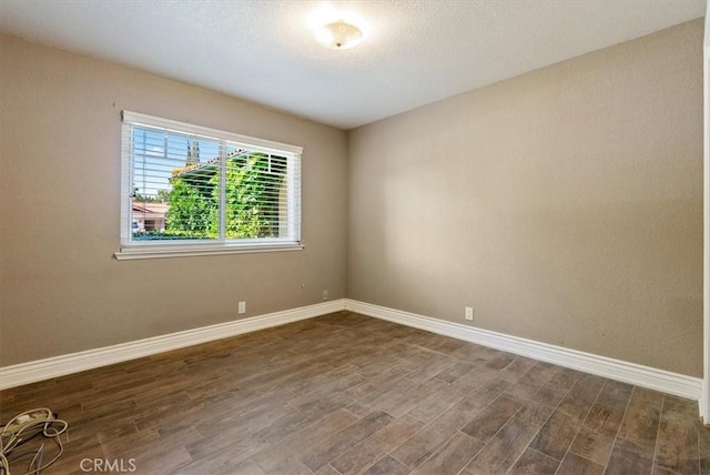 836 Bolen Dr, Paso Robles, CA 93446 - spare room with dark wood-style flooring and baseboards