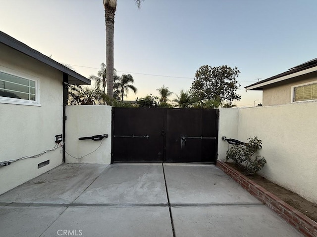 1016 W Teresa St, West Covina, CA 91790 - patio terrace at dusk with a gate