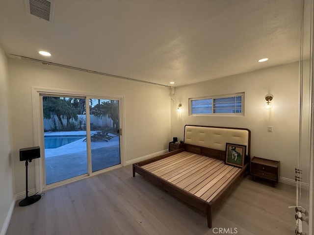 1016 W Teresa St, West Covina, CA 91790 - unfurnished bedroom with access to exterior, wood finished floors, and recessed lighting