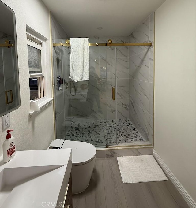 1016 W Teresa St, West Covina, CA 91790 - bathroom featuring vanity, a marble finish shower, and wood finished floors