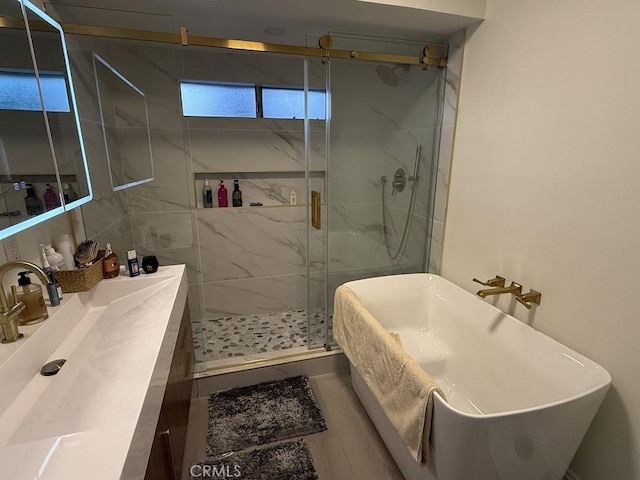 1016 W Teresa St, West Covina, CA 91790 - full bathroom with a soaking tub, a shower stall, and vanity