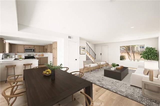 516 Sefton Ave Unit A, Monterey Park, CA 91755 - dining area featuring light wood-style flooring and stairs