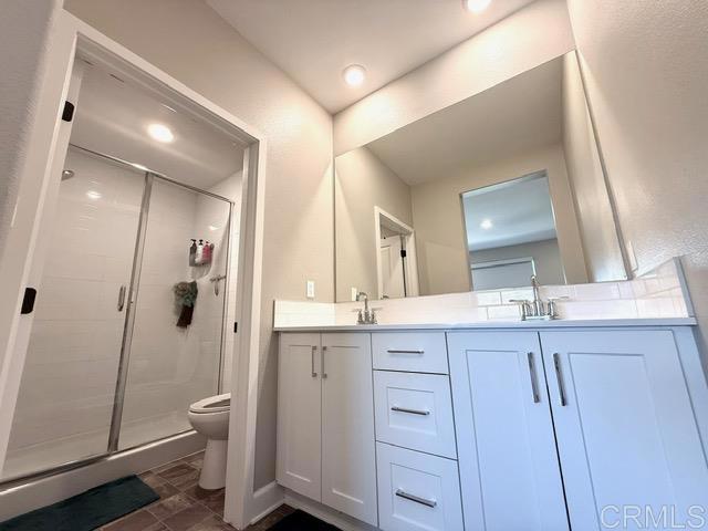 1959 Minimalist Ln, Chula Vista, CA 91915 - full bath featuring a stall shower, double vanity, and recessed lighting