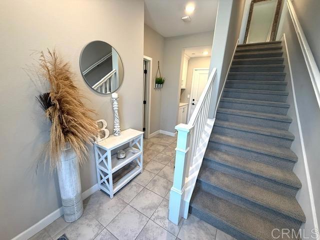 1959 Minimalist Ln, Chula Vista, CA 91915 - stairs featuring tile patterned flooring and baseboards