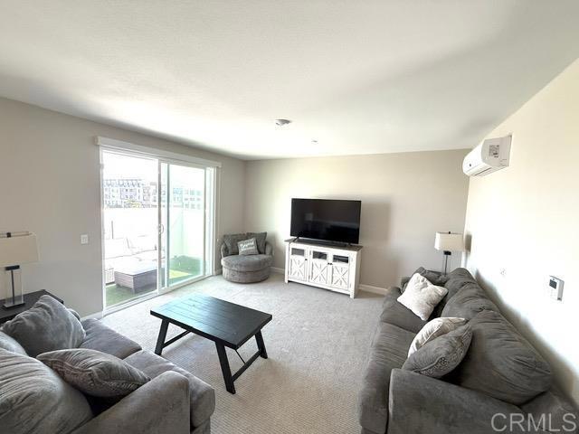 1959 Minimalist Ln, Chula Vista, CA 91915 - living room featuring light colored carpet and baseboards