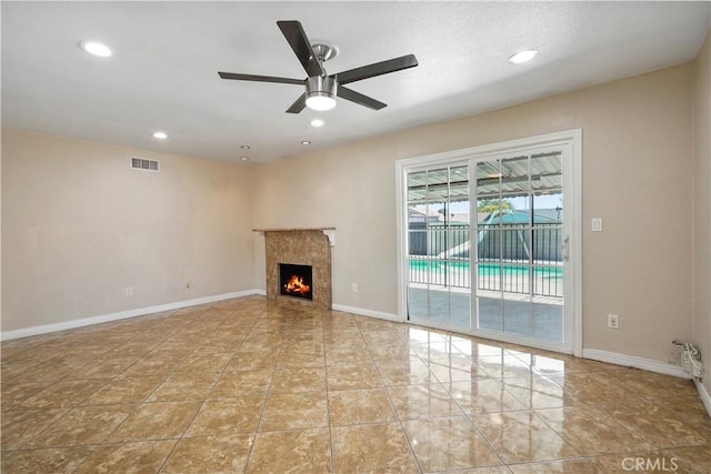 10265 Lev Ave, Arleta, CA 91331 - unfurnished living room featuring a ceiling fan, a high end fireplace, and recessed lighting