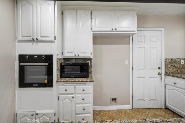 10265 Lev Ave, Arleta, CA 91331 - kitchen featuring black appliances, white cabinetry, dark stone countertops, and light tile patterned floors