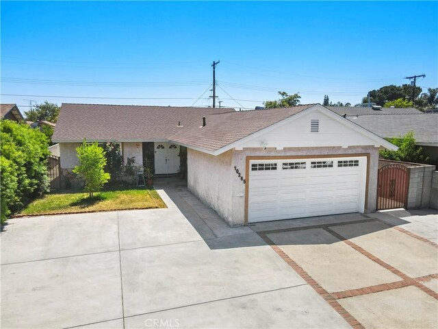 10265 Lev Ave, Arleta, CA 91331 - single story home featuring driveway, stucco siding, an attached garage, a gate, and a shingled roof