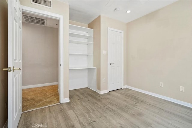 10265 Lev Ave, Arleta, CA 91331 - unfurnished bedroom with wood finished floors and recessed lighting