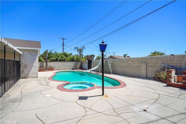 10265 Lev Ave, Arleta, CA 91331 - view of swimming pool with a water slide, a fenced backyard, a patio, and a pool with connected hot tub
