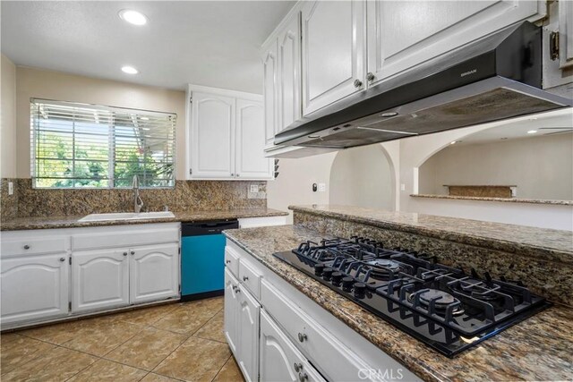 10265 Lev Ave, Arleta, CA 91331 - kitchen with black gas stovetop, dishwashing machine, under cabinet range hood, white cabinets, and light tile patterned flooring