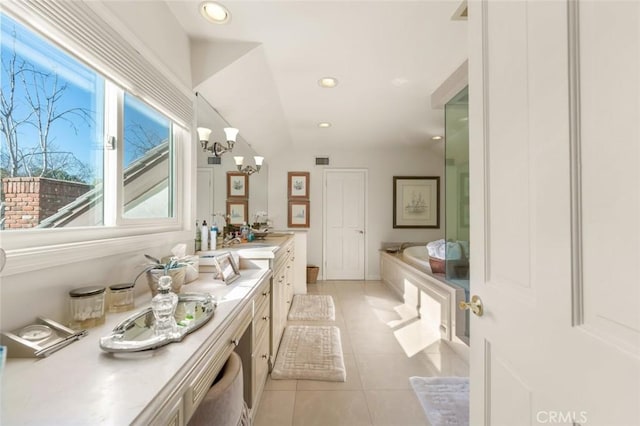 5250 Scott Robertson Rd, Hidden Hills, CA 91302 - full bath with a bath, double vanity, tile patterned floors, recessed lighting, and a chandelier