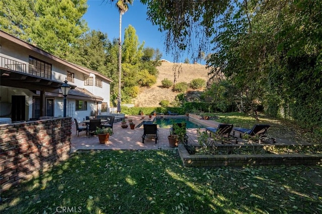 5250 Scott Robertson Rd, Hidden Hills, CA 91302 - view of green lawn featuring a patio area, an outdoor pool, and a balcony