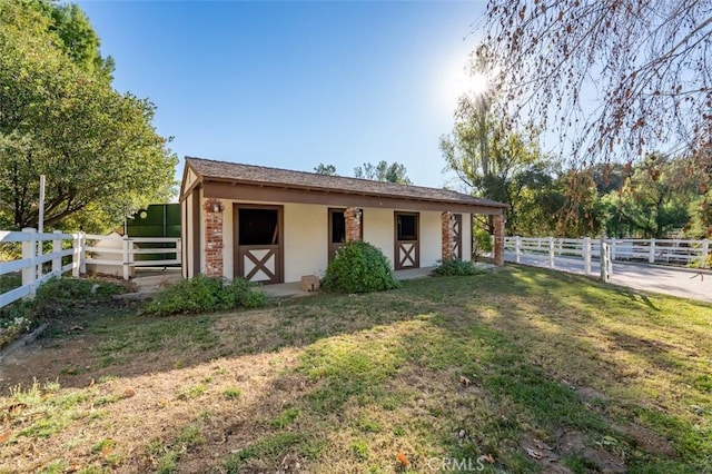 5250 Scott Robertson Rd, Hidden Hills, CA 91302 - view of front of house with an exterior structure, stucco siding, and an outdoor structure