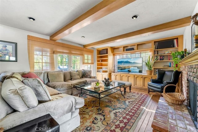 5250 Scott Robertson Rd, Hidden Hills, CA 91302 - living area featuring beamed ceiling, a fireplace, and hardwood / wood-style flooring