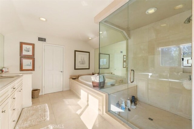 5250 Scott Robertson Rd, Hidden Hills, CA 91302 - full bath featuring a garden tub, lofted ceiling, vanity, a shower stall, and tile patterned flooring