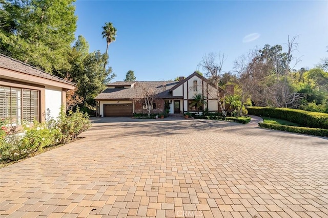 5250 Scott Robertson Rd, Hidden Hills, CA 91302 - view of front of house featuring decorative driveway and a garage