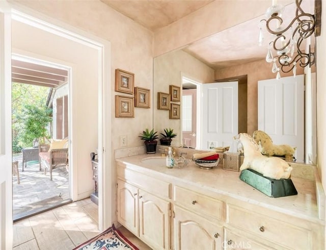 5250 Scott Robertson Rd, Hidden Hills, CA 91302 - bathroom with vanity and a chandelier