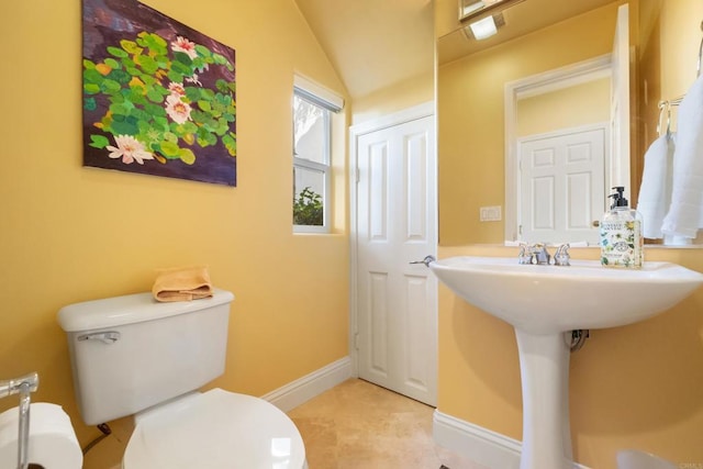 7243 Surfbird Cir, Carlsbad, CA 92011 - half bathroom featuring vaulted ceiling and tile patterned flooring