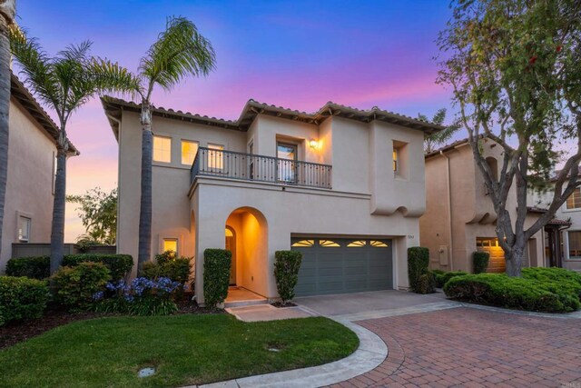 7243 Surfbird Cir, Carlsbad, CA 92011 - mediterranean / spanish home featuring a balcony, stucco siding, driveway, a garage, and a tiled roof