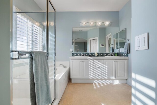 7243 Surfbird Cir, Carlsbad, CA 92011 - full bathroom featuring double vanity, a garden tub, and a shower stall