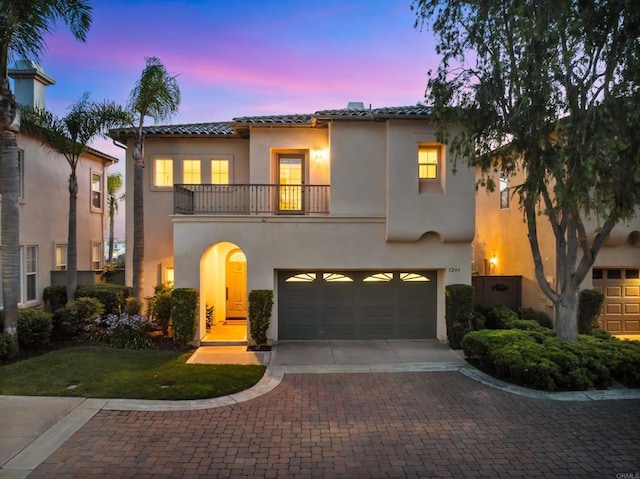 7243 Surfbird Cir, Carlsbad, CA 92011 - mediterranean / spanish house featuring a balcony, stucco siding, a tile roof, and decorative driveway